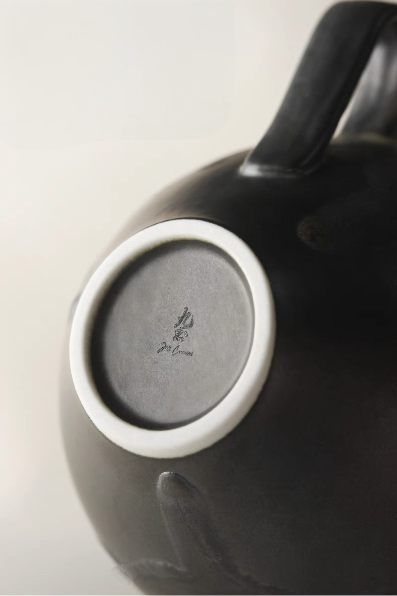 Kiln-Change Dark Green ceramic coffee cup base detail showing stamped bottom and smooth ceramic finish