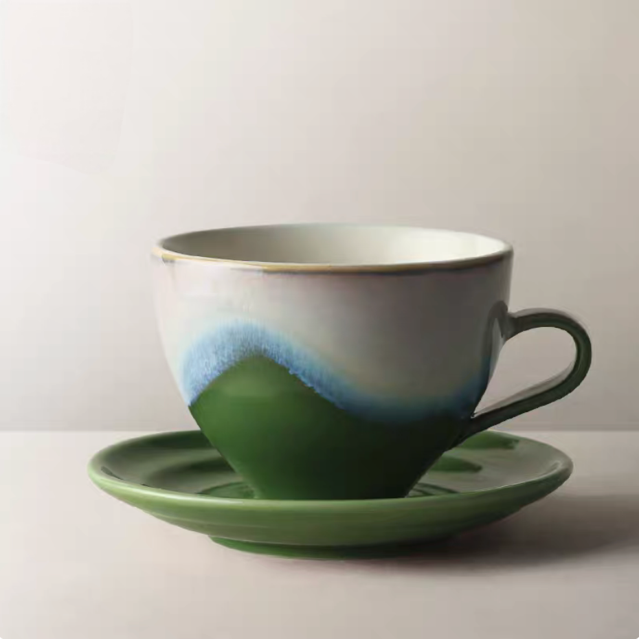 Kiln-Change Green ceramic coffee cup and saucer front view with layered green glaze inspired by landscape tones
