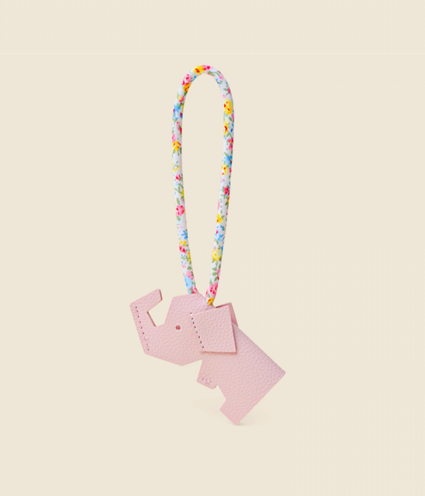 Pink elephant keychain charm angled view with floral strap