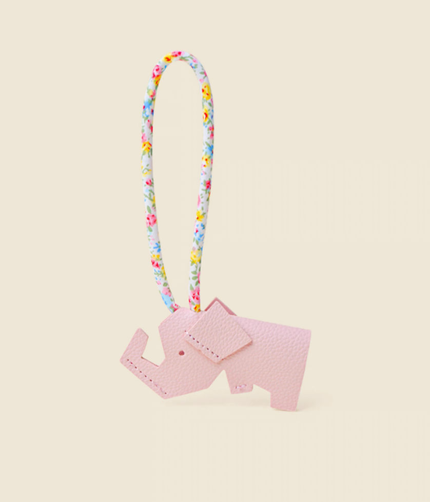 Pink elephant keychain charm side view showing body shape and strap