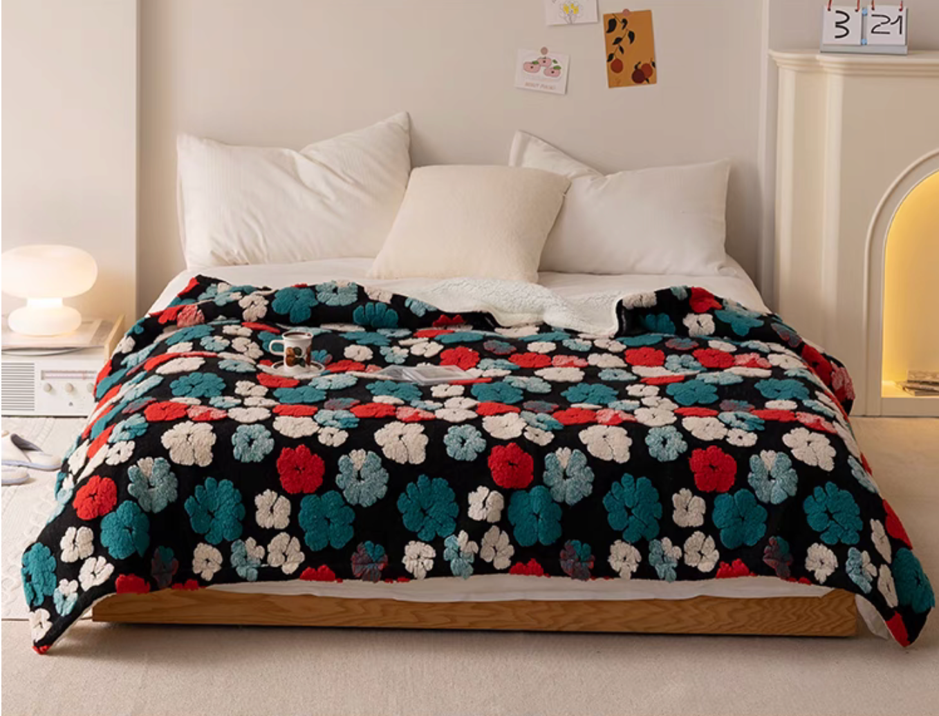 Jacquard Green floral fleece throw blanket styled across bed with pillows