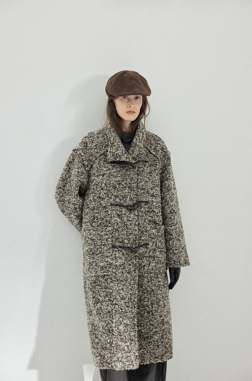 Gray Marl long bouclé wool coat fastened with faux-horn toggles, showing the stand collar and patch pockets