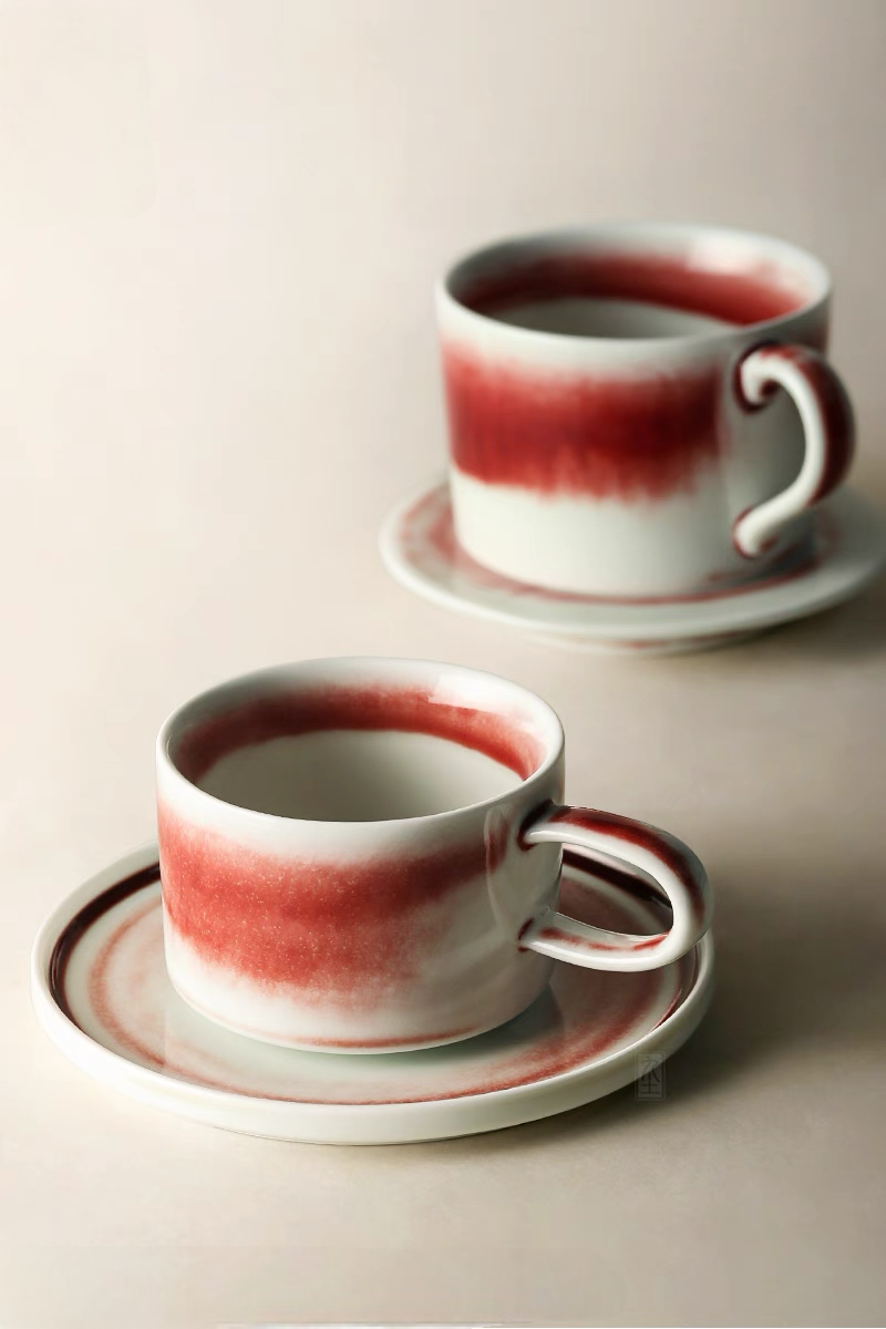 Handcrafted crimson glaze ceramic cup and saucer set in beige and red showing multiple styles with artistic gradient finish
