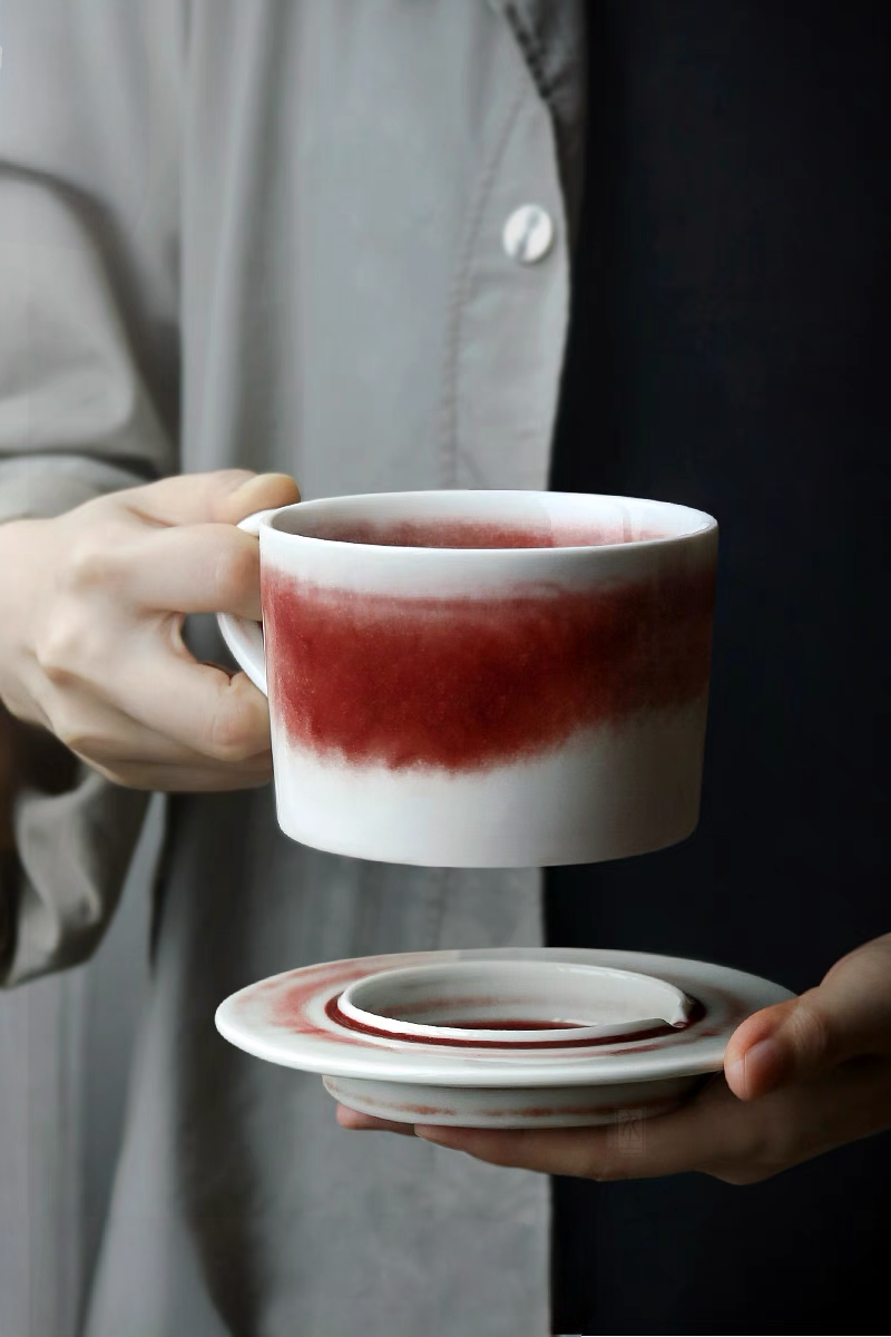 Style 2 ceramic coffee cup filled with coffee held in hands highlighting warmth and premium handcrafted design