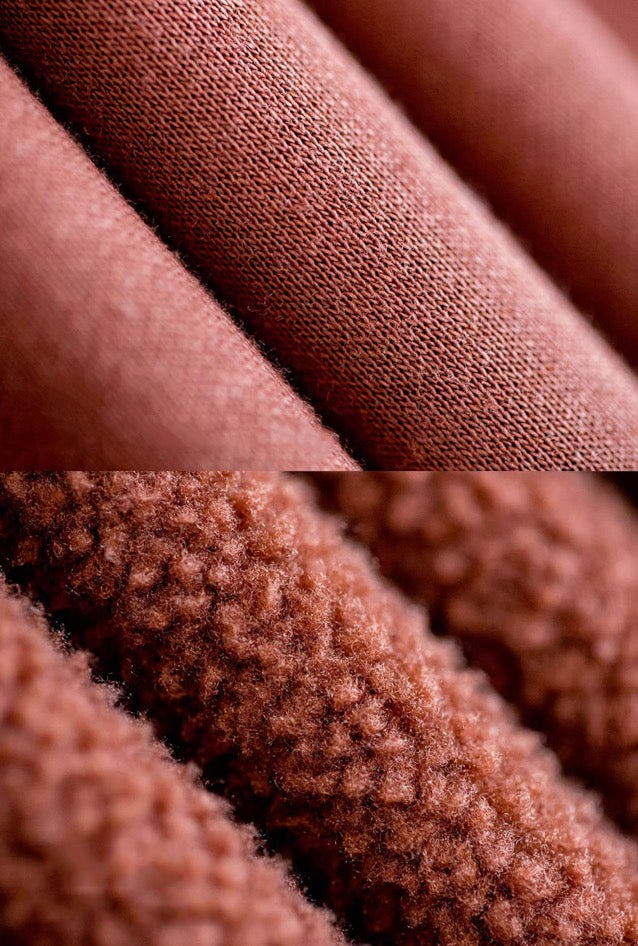 Macro detail of warm clay fleece—outer knit and inner plush pile