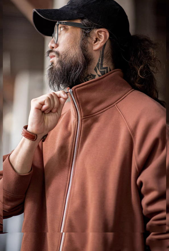 Warm clay fleece zip jacket on model, close-up zipping stand collar