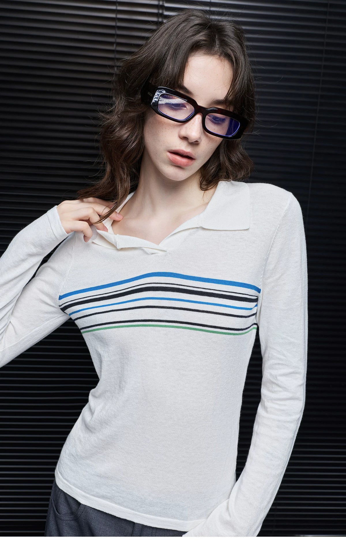 Close-up of Ivory Stripe polo sweater showing Johnny collar, open V neckline and contrast chest stripes
