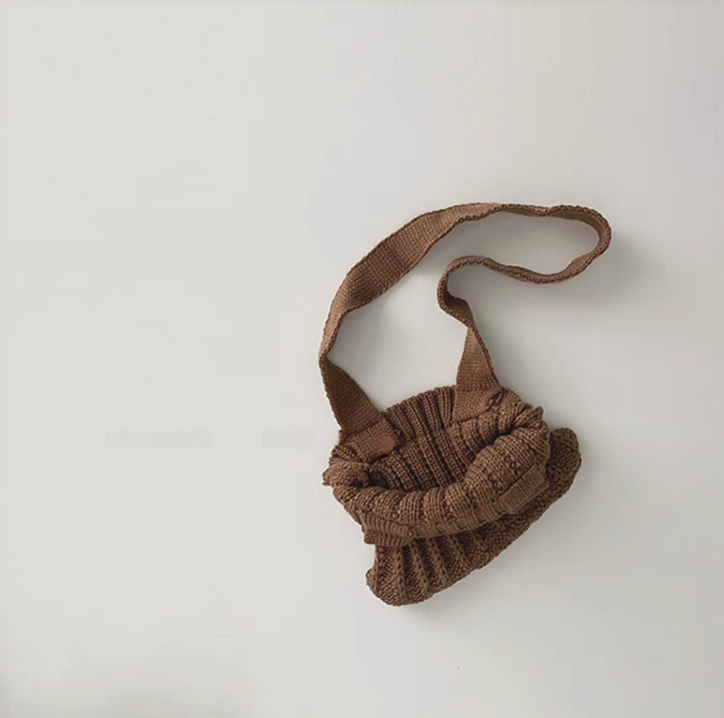 Kids knit crossbody bag in coffee color showing open flexible structure and knit texture detail