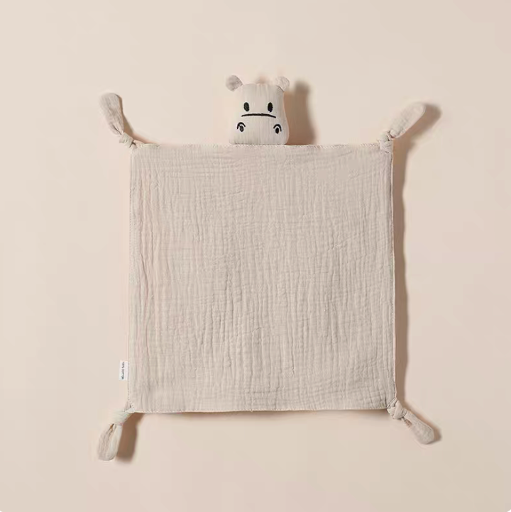 Light Khaki muslin baby comfort cloth with plush animal head and knotted corners laid flat