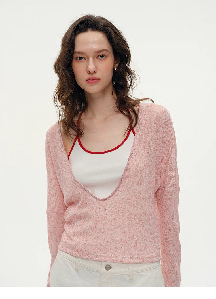 Close-up of Misty Pink layered V-neck summer knit with deep curved neckline