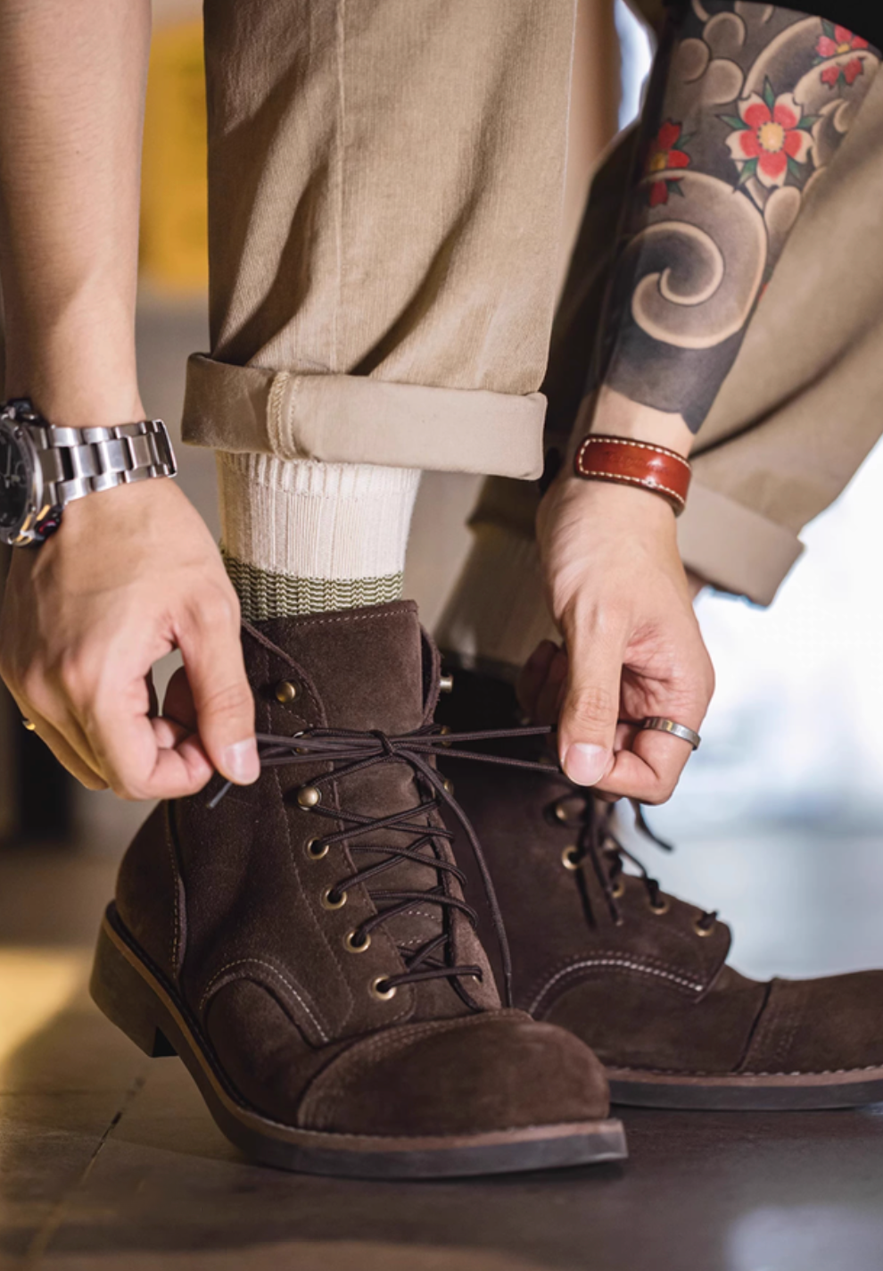 Lucky Chunky Knit Socks in moss green paired with brown lace-up boots and cuffed pants for a stylish rugged outfit