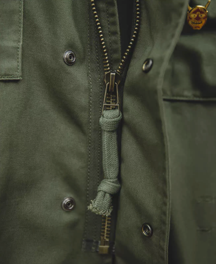 M65 Field Jacket Styled Over Denim Shirt and Chinos in Street Fashion