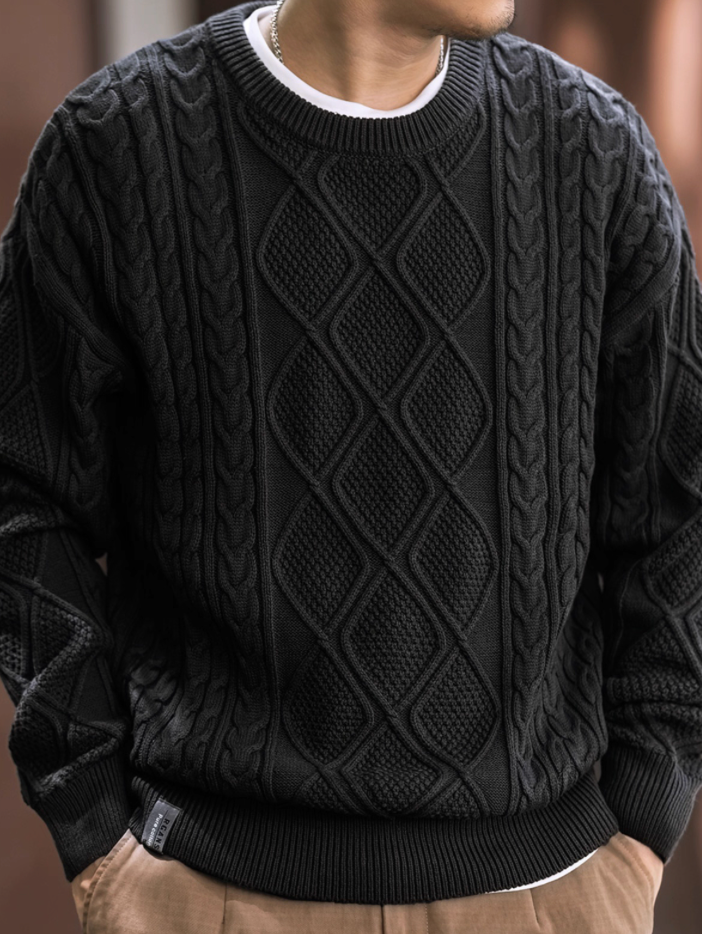 Men’s black diamond cable knit sweater front view, crewneck pullover.