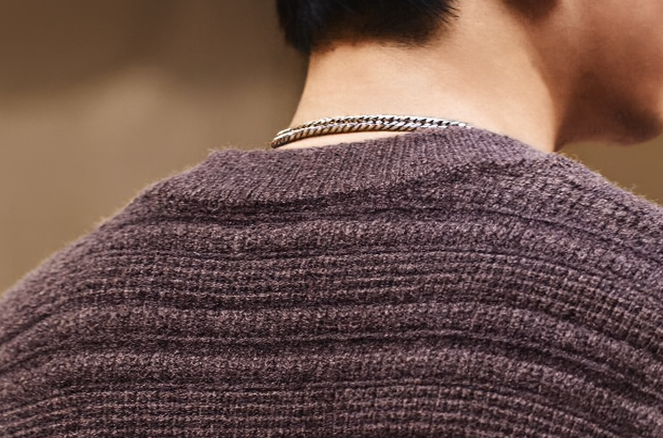 Back neckline detail of brown textured Henley sweater with soft horizontal ribbed knit.