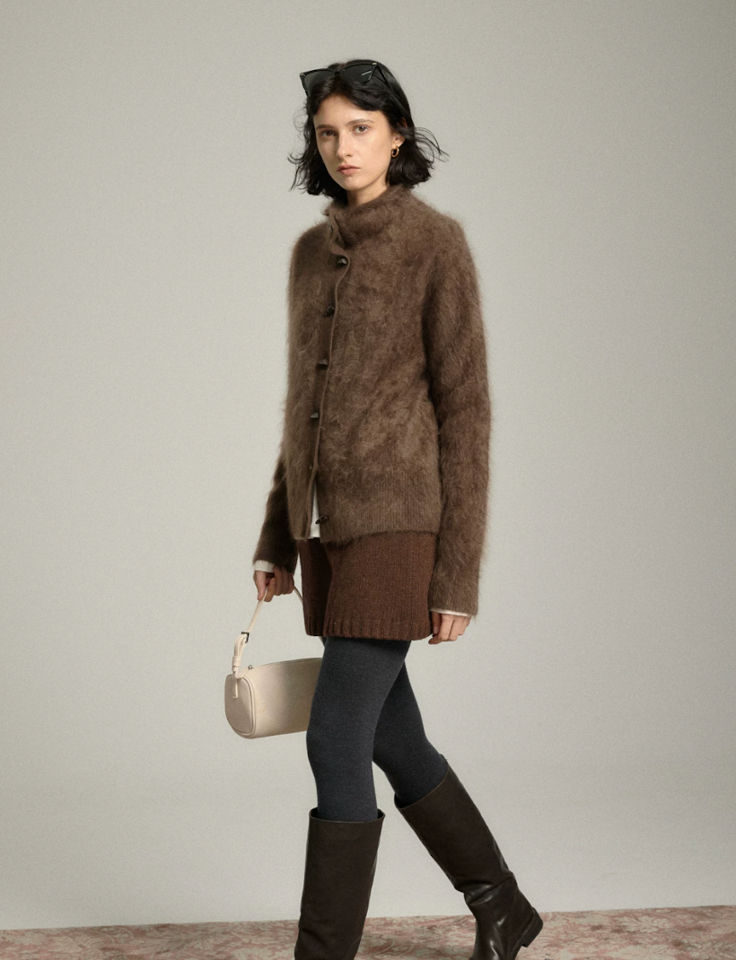 Mocha halo-soft cashmere cardigan in motion, showing the relaxed straight cut and scrunched collar