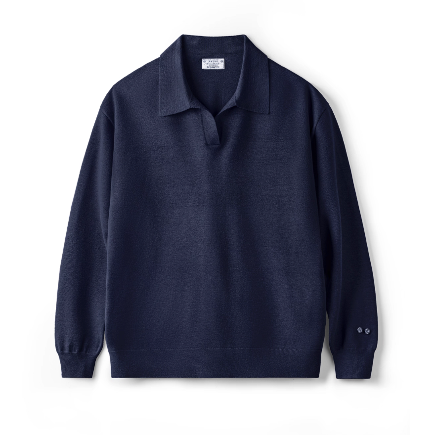 Flat lay of navy blue knit polo sweater with soft knit texture and collar.
