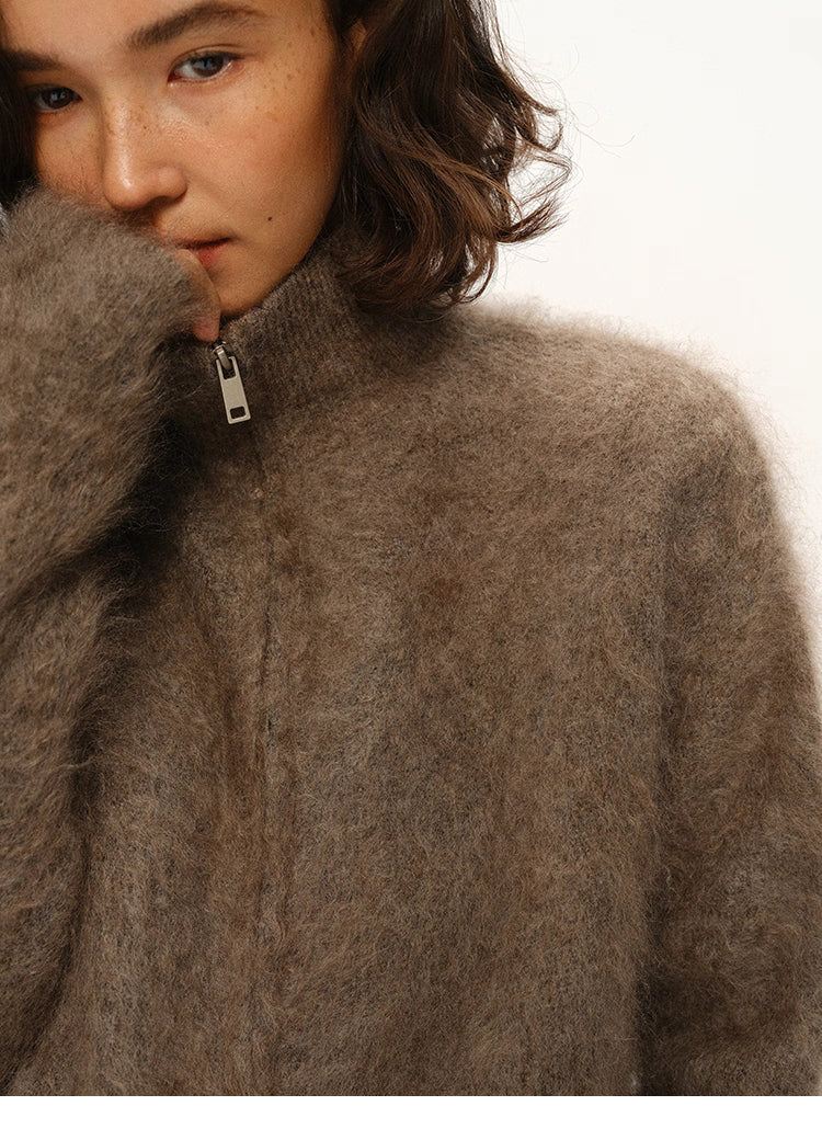 Close-up of double zipper detail on smoky brown mohair cardigan