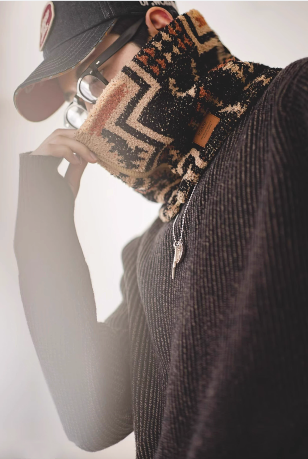 Close-up of Mocha Navajo-Inspired Half-Sherpa Neck Warmer showing soft sherpa texture and geometric pattern detail