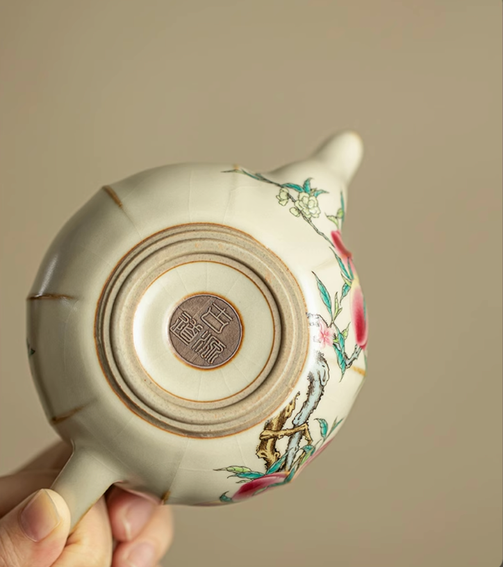 Bottom view of Nine Peach Ru Kiln Crackle Glazed Teapot in Nine Peach showing base stamp mark and crackle glaze texture