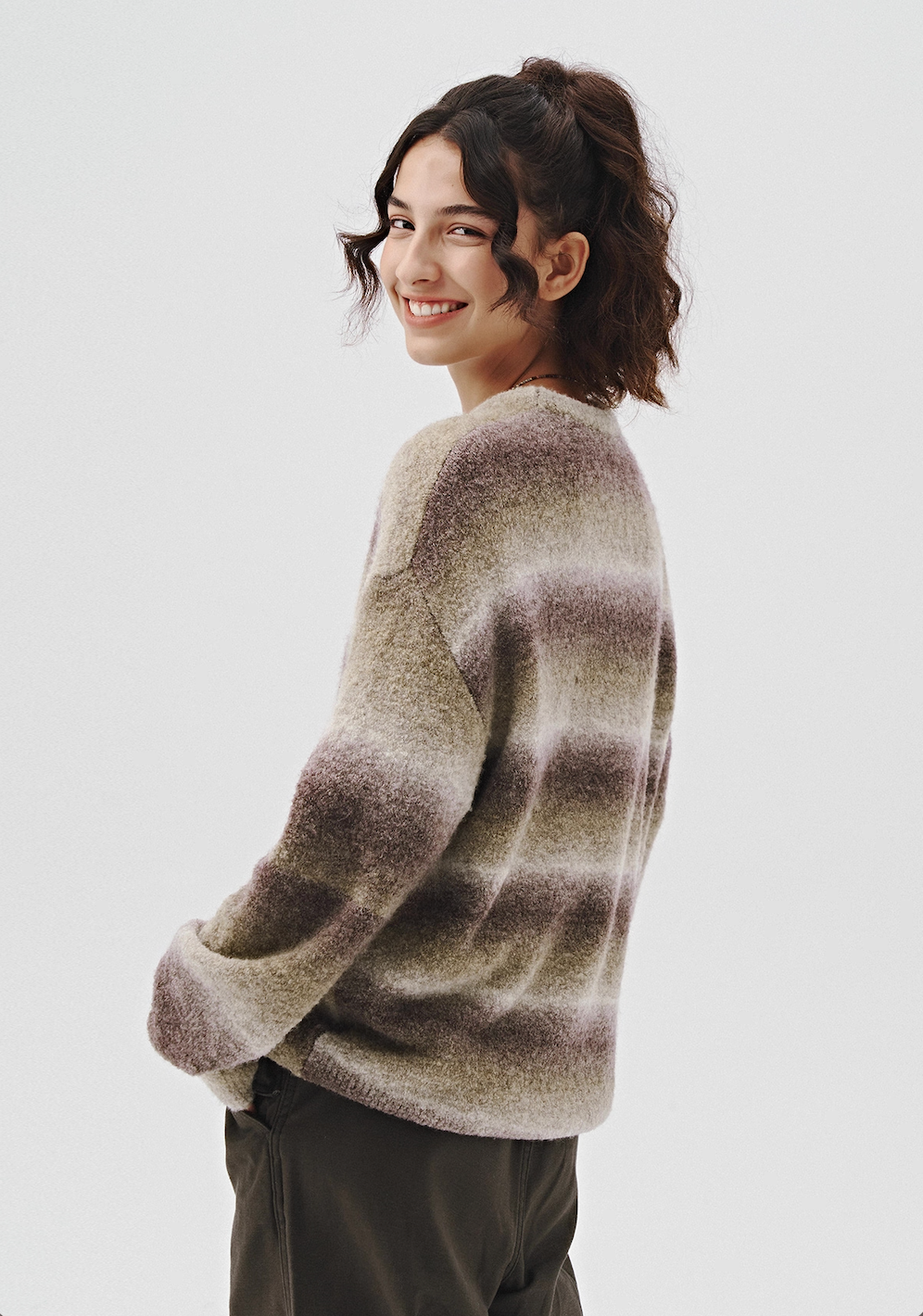 Back view of women’s gradient ombre knit sweater, soft brushed feel.