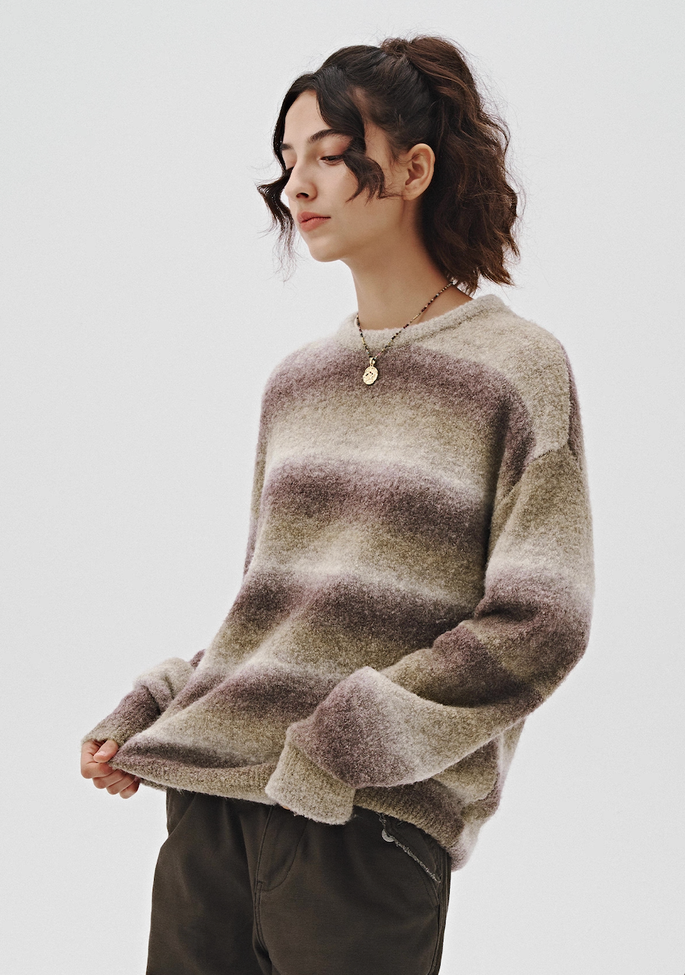 Women’s ombre fuzzy sweater in cool grey purple, side profile.