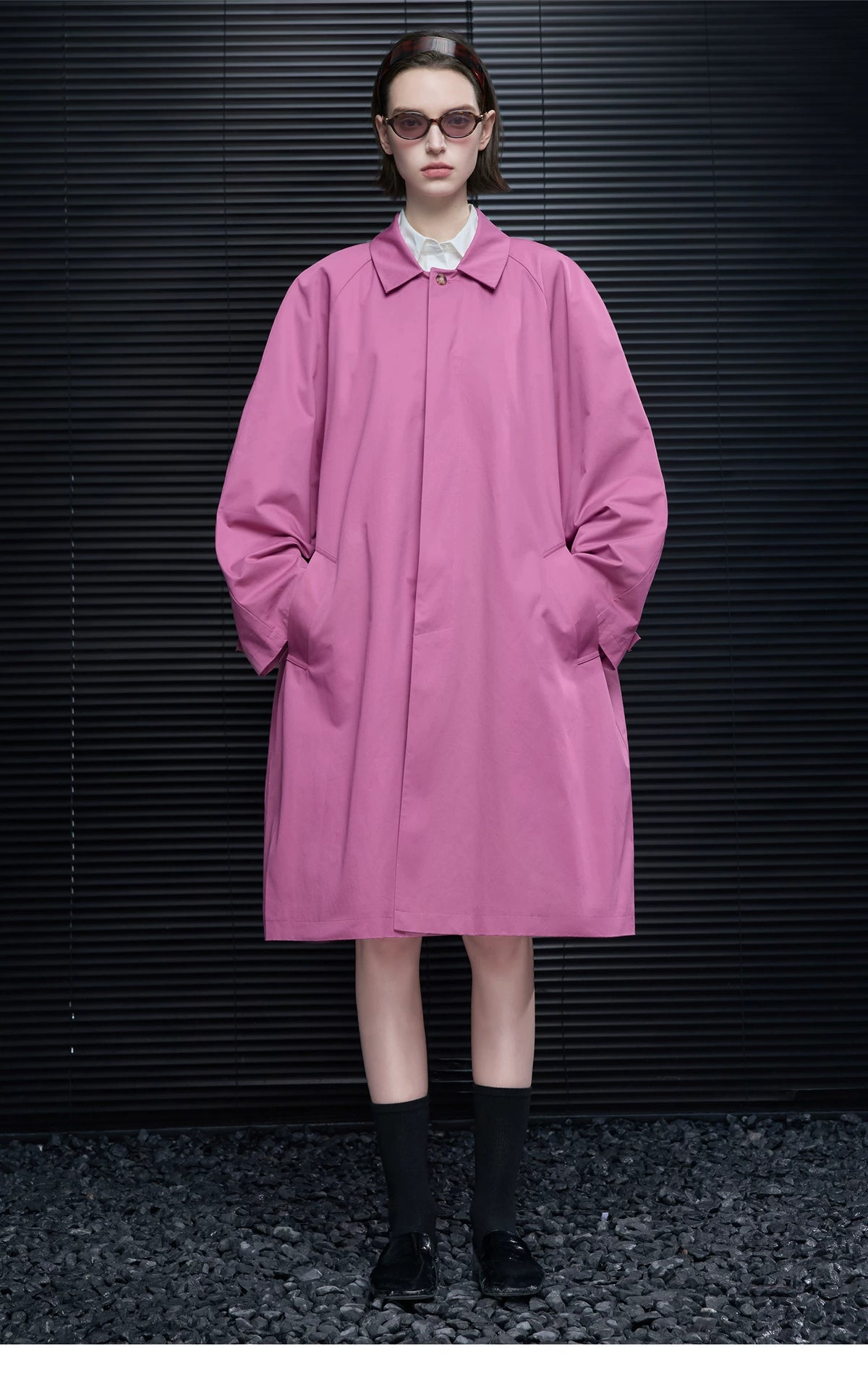 Front view of an Orchid Pink A-line coat buttoned closed with a clean concealed placket