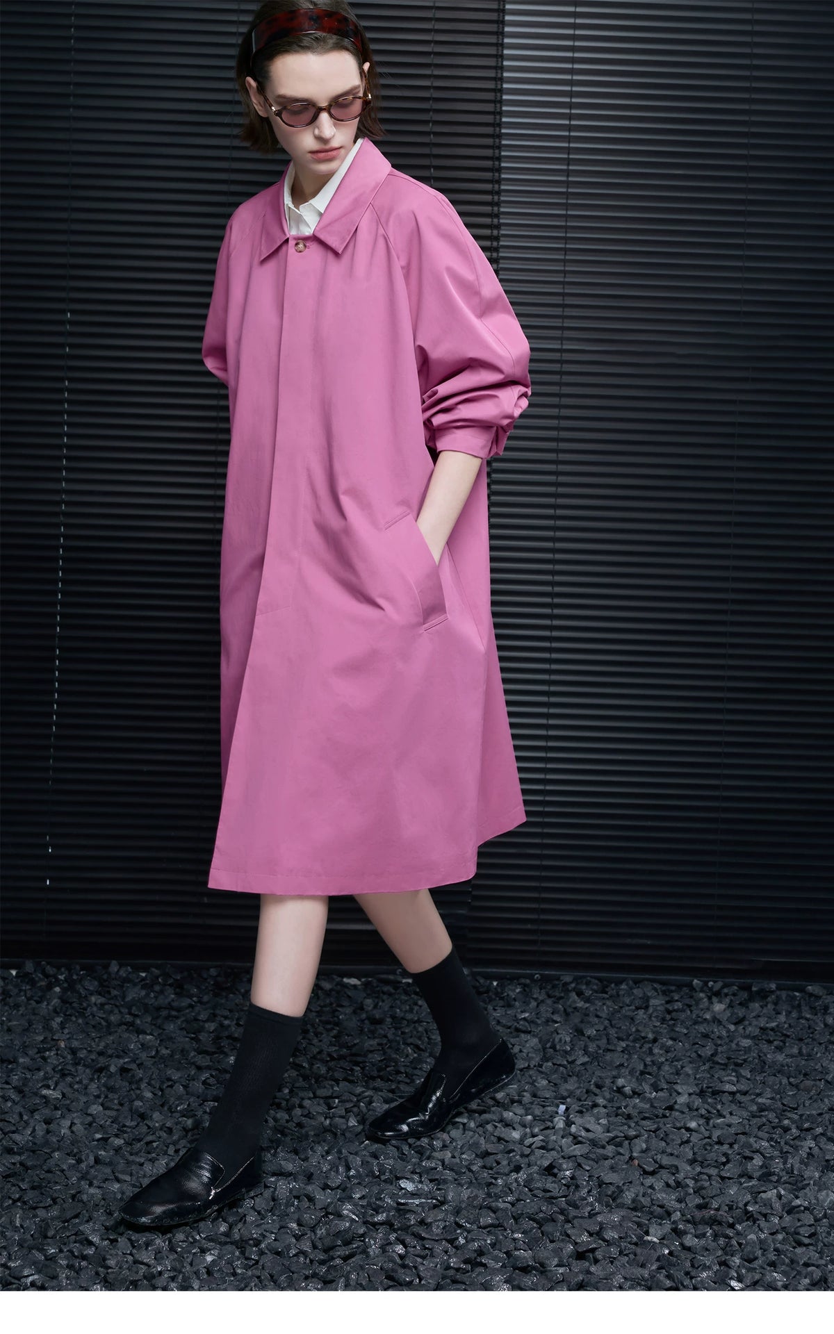 Orchid Pink A-line cotton coat in motion, showing the concealed placket and wide raglan sleeves