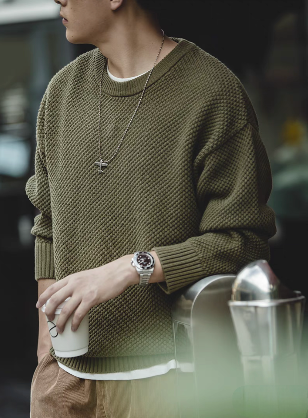 Pineapple Textured Crewneck Sweater warsaw green worn casually holding cup showcasing relaxed fit and textured fabric