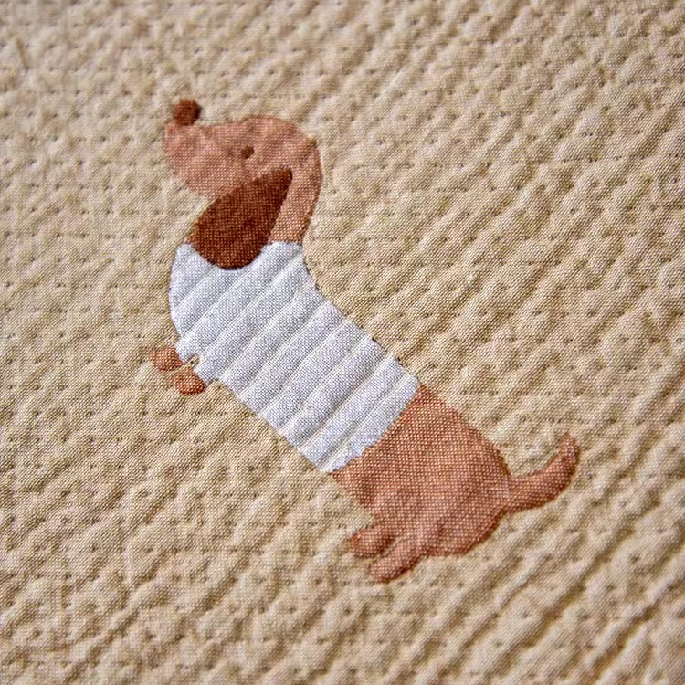 Detailed cotton gauze texture view of Playful Pals Cotton Gauze Quilted Blanket Puppy highlighting soft quilted weave