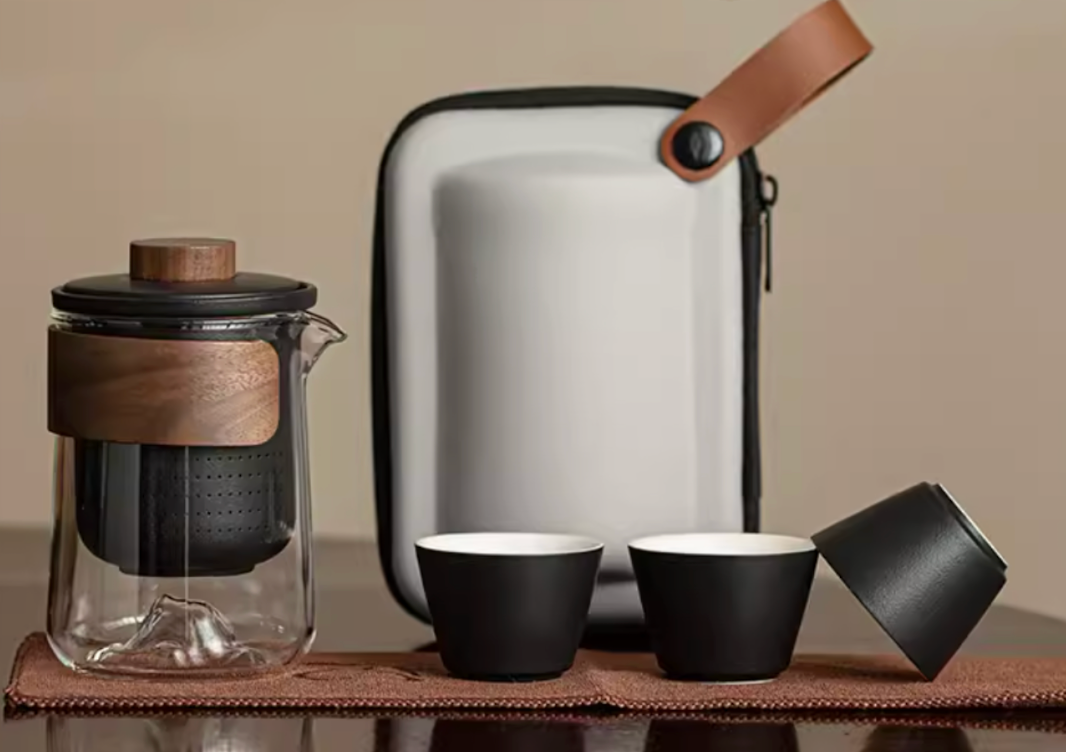 Black portable outdoor travel tea set with glass teapot ceramic cups and carrying case