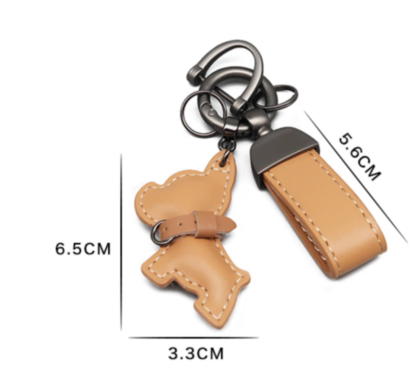 PU leather puppy keychain with wrist strap, tan color. Size reference showing dog charm 6.5 × 3.3 cm and strap 5.6 cm with metal rings.