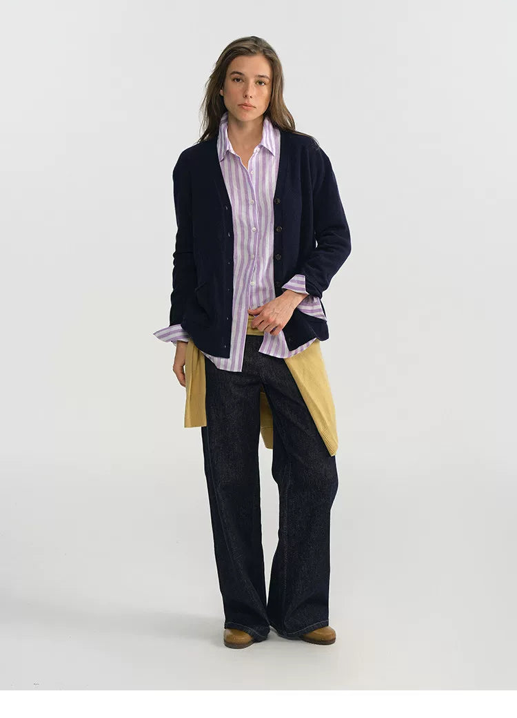 Purple stripe linen shirt layered under navy cardigan, front view