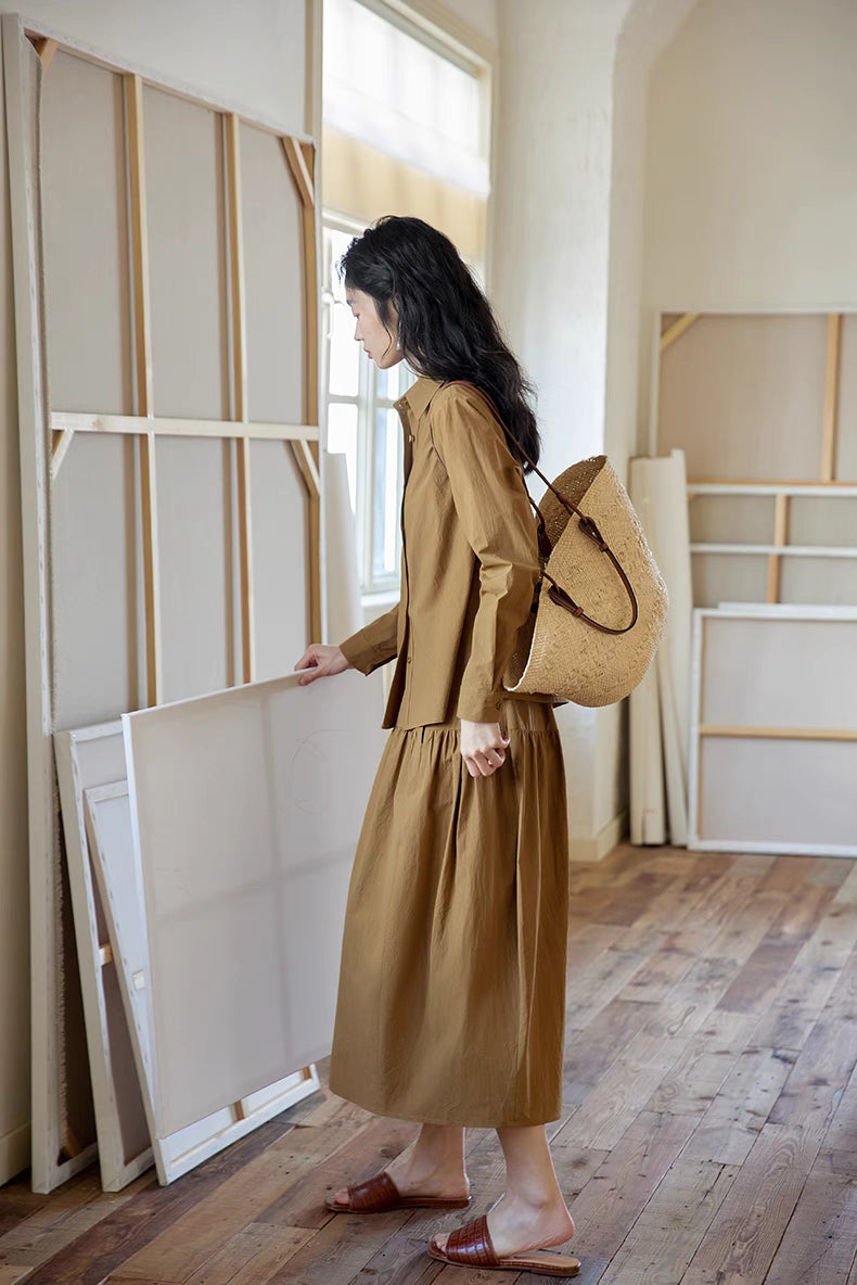 Side-back view of Earth Tone long-sleeve cotton set with woven bag, highlighting fluid drape and versatile styling