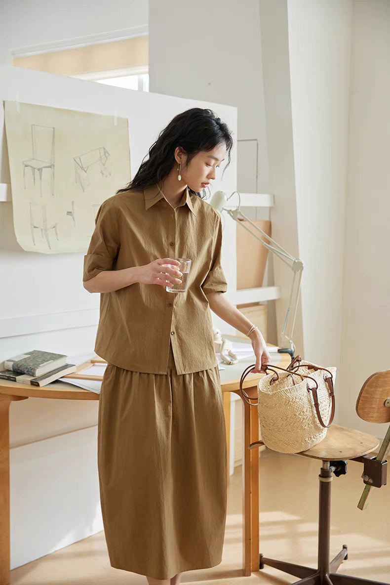 Full-body look of Earth Tone short-sleeve cotton set with woven bag, showing relaxed silhouette and natural lifestyle styling