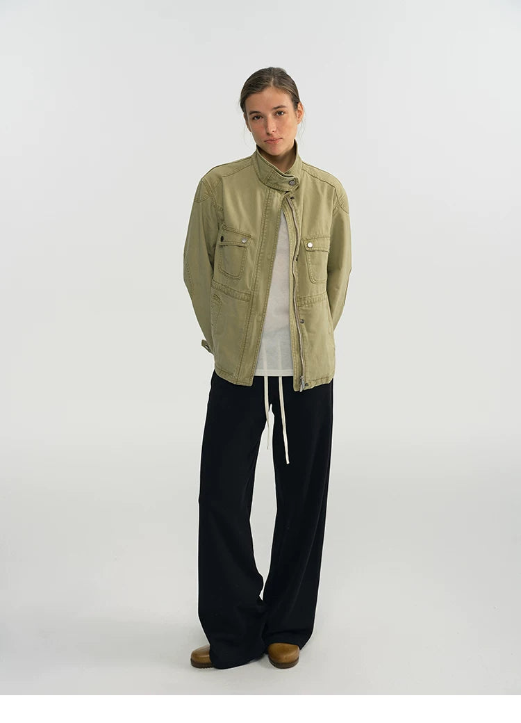 Full-length front view of a sage green relaxed-fit field jacket