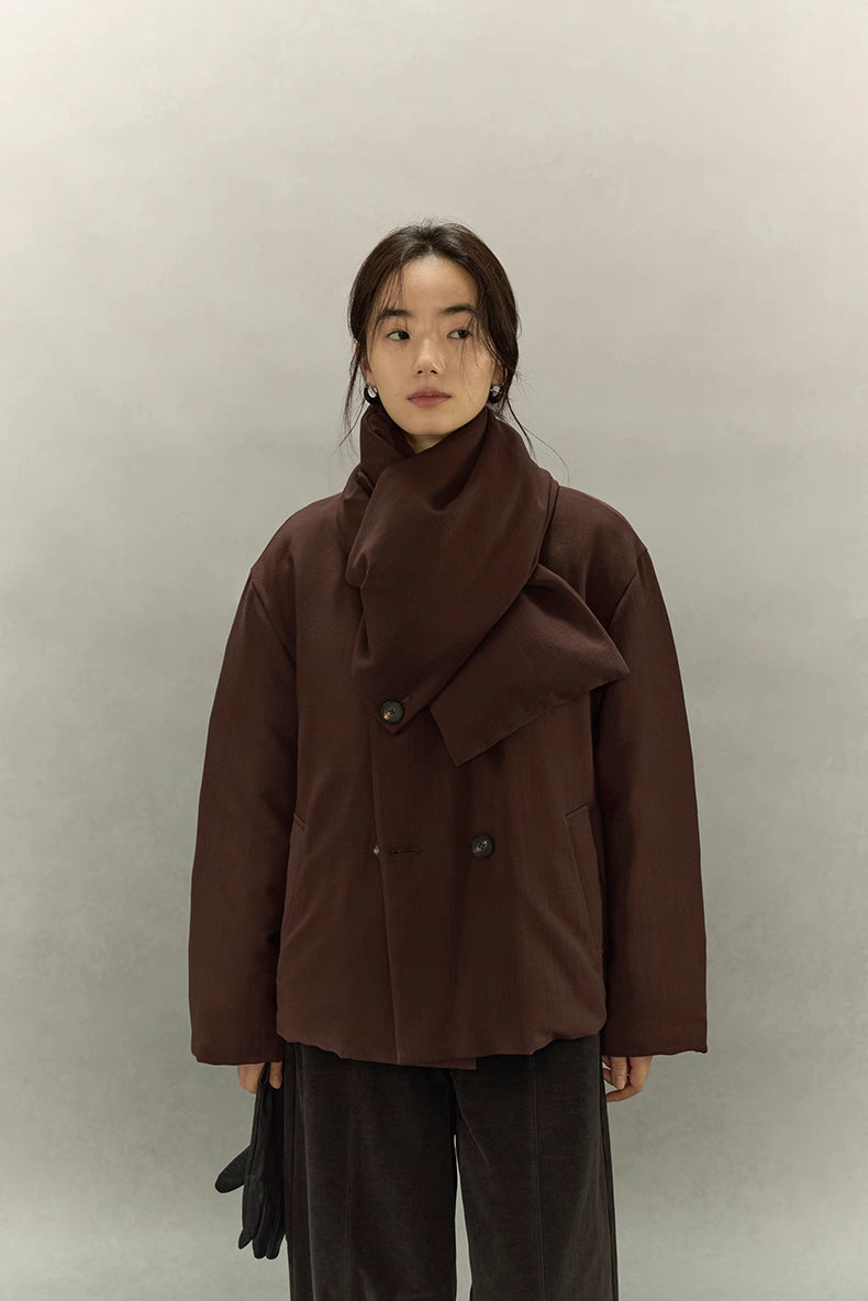 Minimal front shot of double-breasted scarf puffer jacket in dark coffee brown