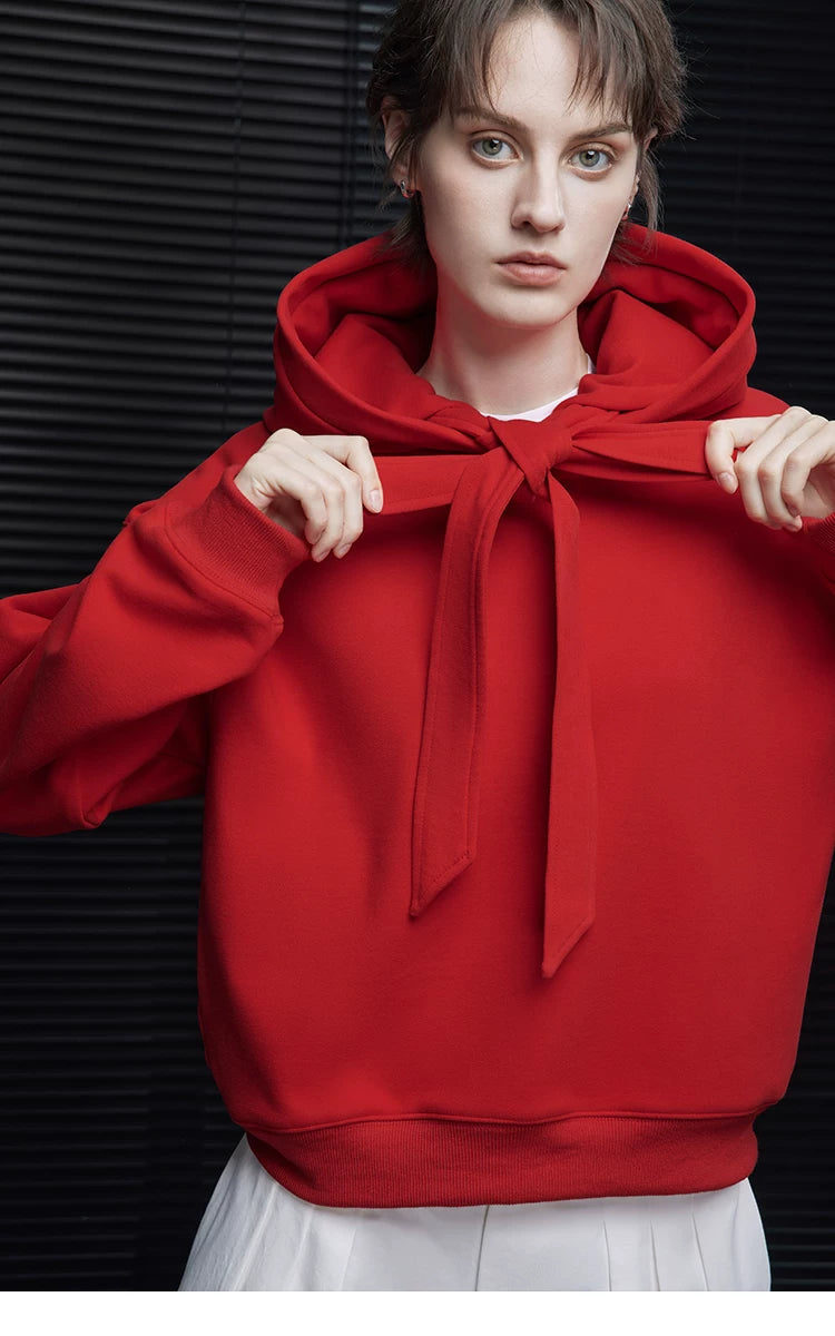 Close-up of Scarlet Red heavyweight hoodie with neck ribbons tied into a bow