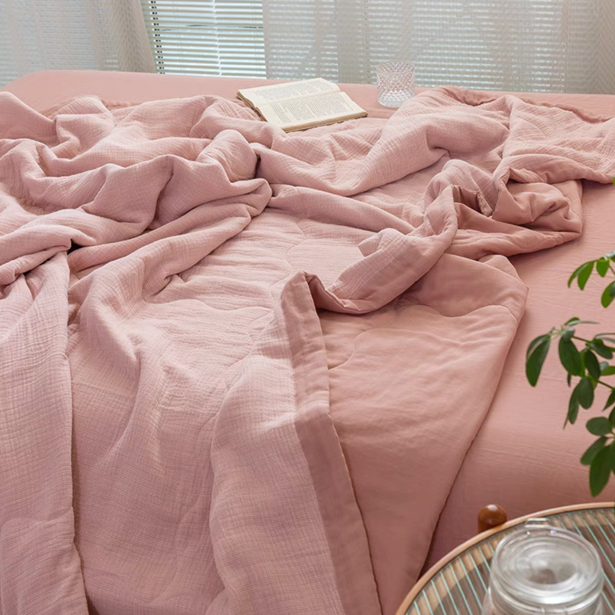 Smoky Pink SoftNest cotton muslin bedding set draped naturally across bed showing lightweight breathable muslin layers