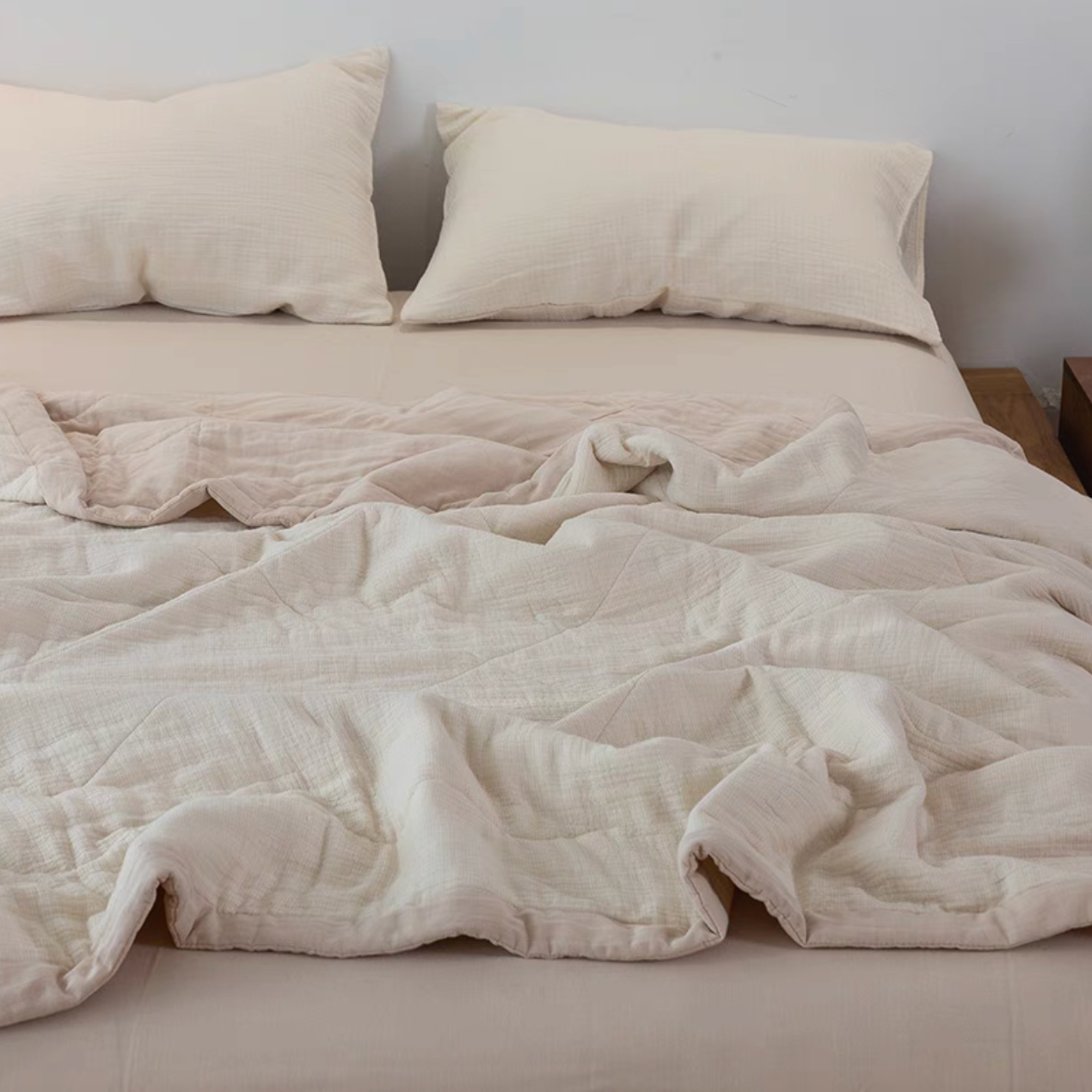 Light Yellow SoftNest triple-layer cotton muslin bedding set spread across bed with matching pillowcases