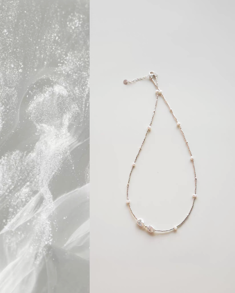 Spaced Baroque and Freshwater Pearl Sterling Silver Choker flat lay with delicate silver chain and asymmetrical pearl accents