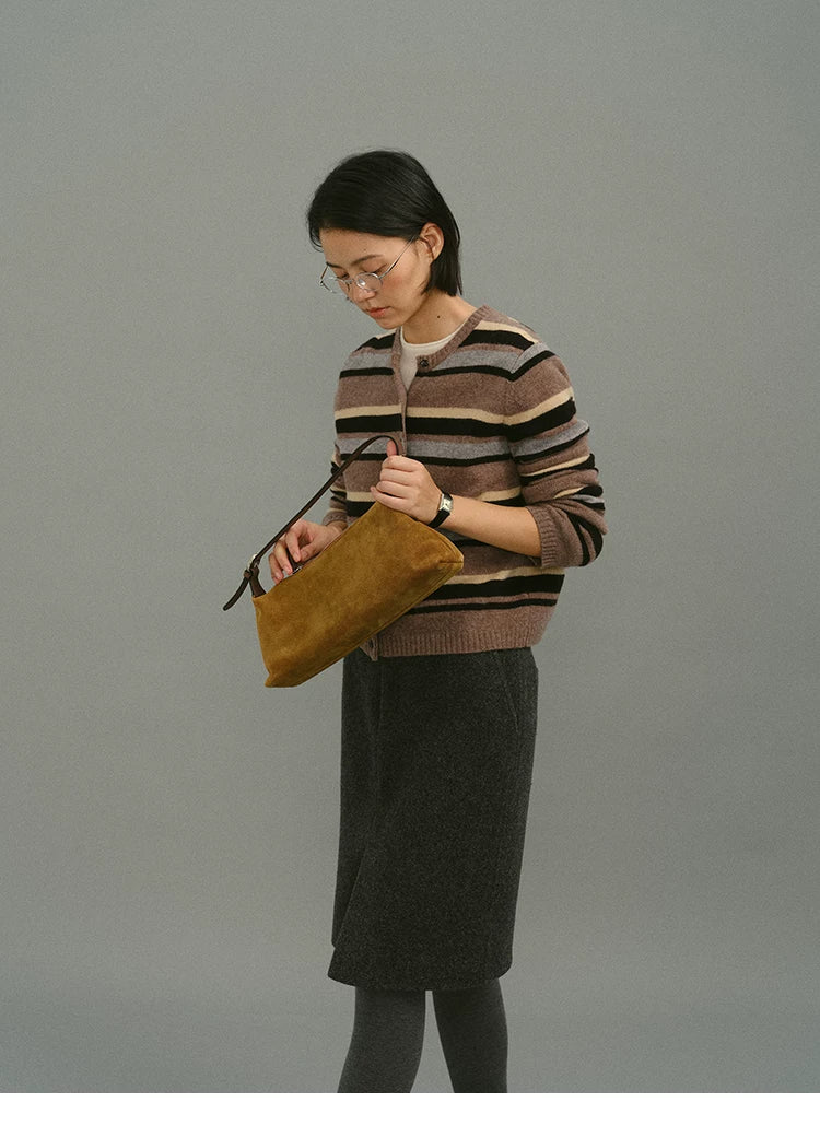 Mocha stripe wool cardigan, side view with bag