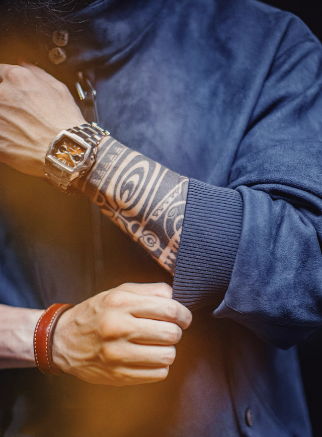 Detail of ribbed cuff and sleeve on navy blue suede Harrington jacket