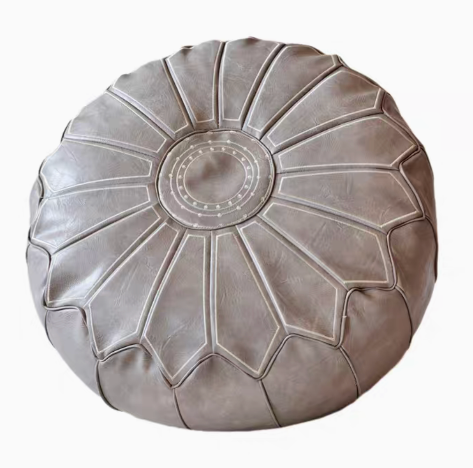 Gray sunburst embroidered faux leather pouf ottoman top view with stitched medallion design