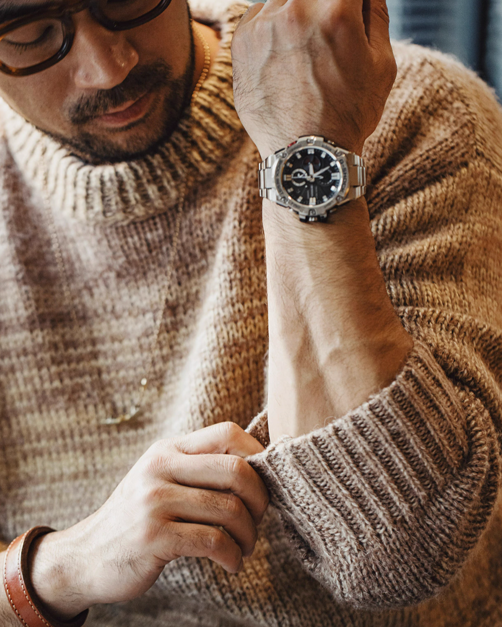 Close up of Sunset Drift Knit Sweater in Tea Brown showing ribbed cuff detail soft knit texture and premium wool blend fabric