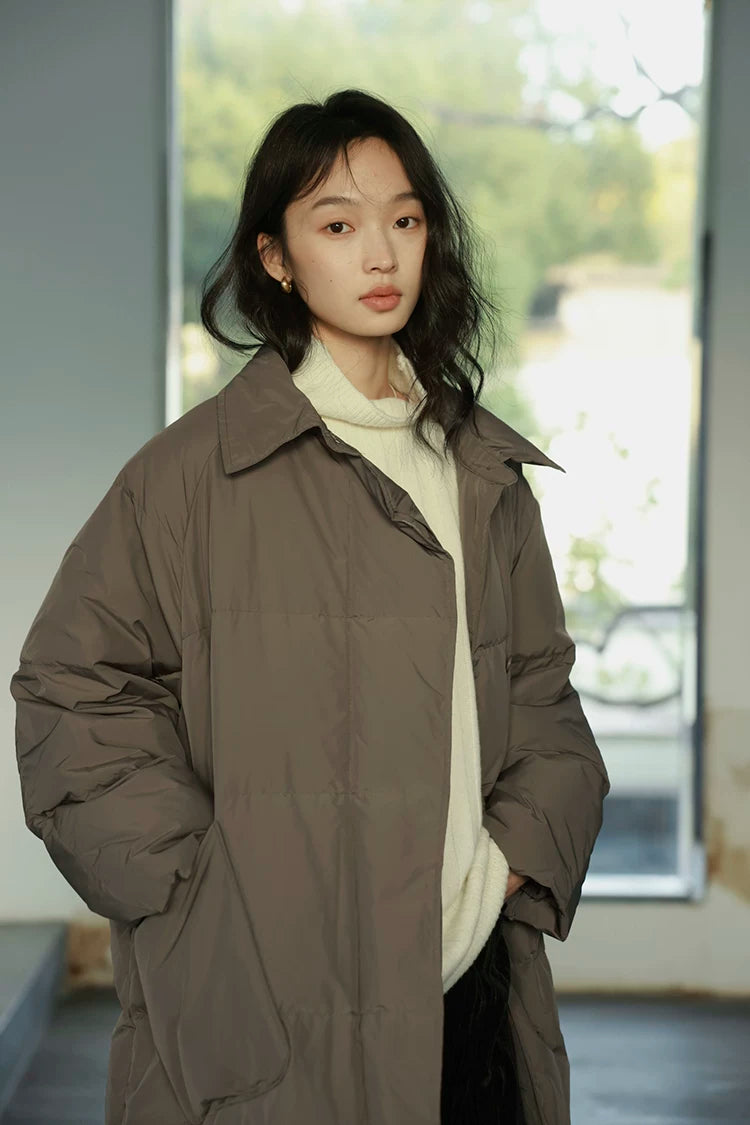 Close-up of a Taupe down coat&