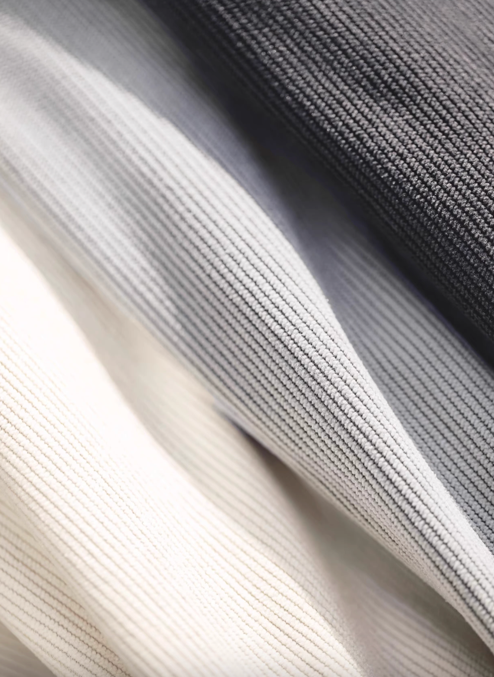 Close-up of Textured Lounge Joggers corduroy fabric showing detailed texture in Dark Gray, Light Gray, and Beige color options