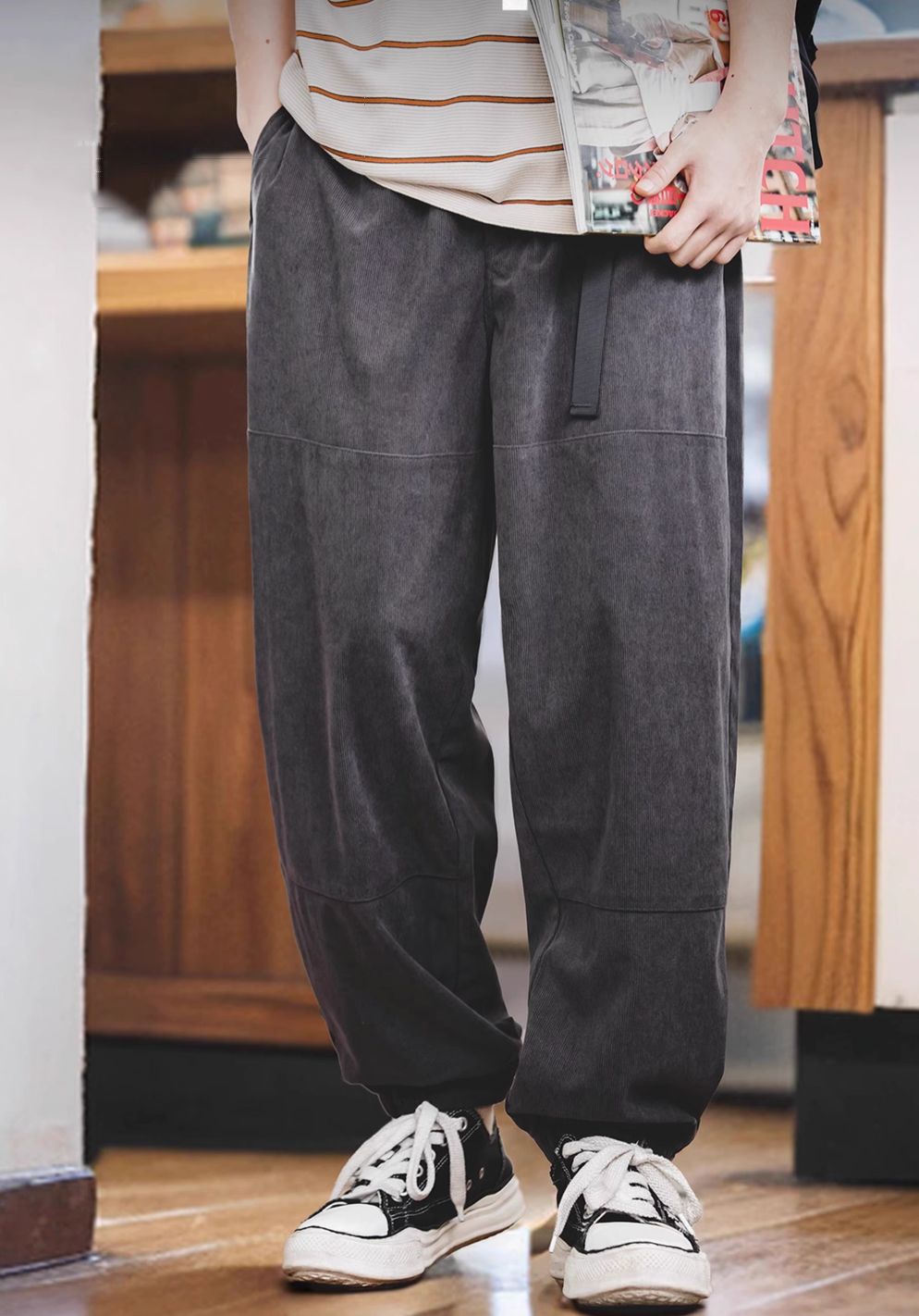 Model wearing Textured Lounge Joggers in Dark Gray featuring corduroy texture, relaxed fit, elastic waistband with belt, and cuffed ankles in indoor setting