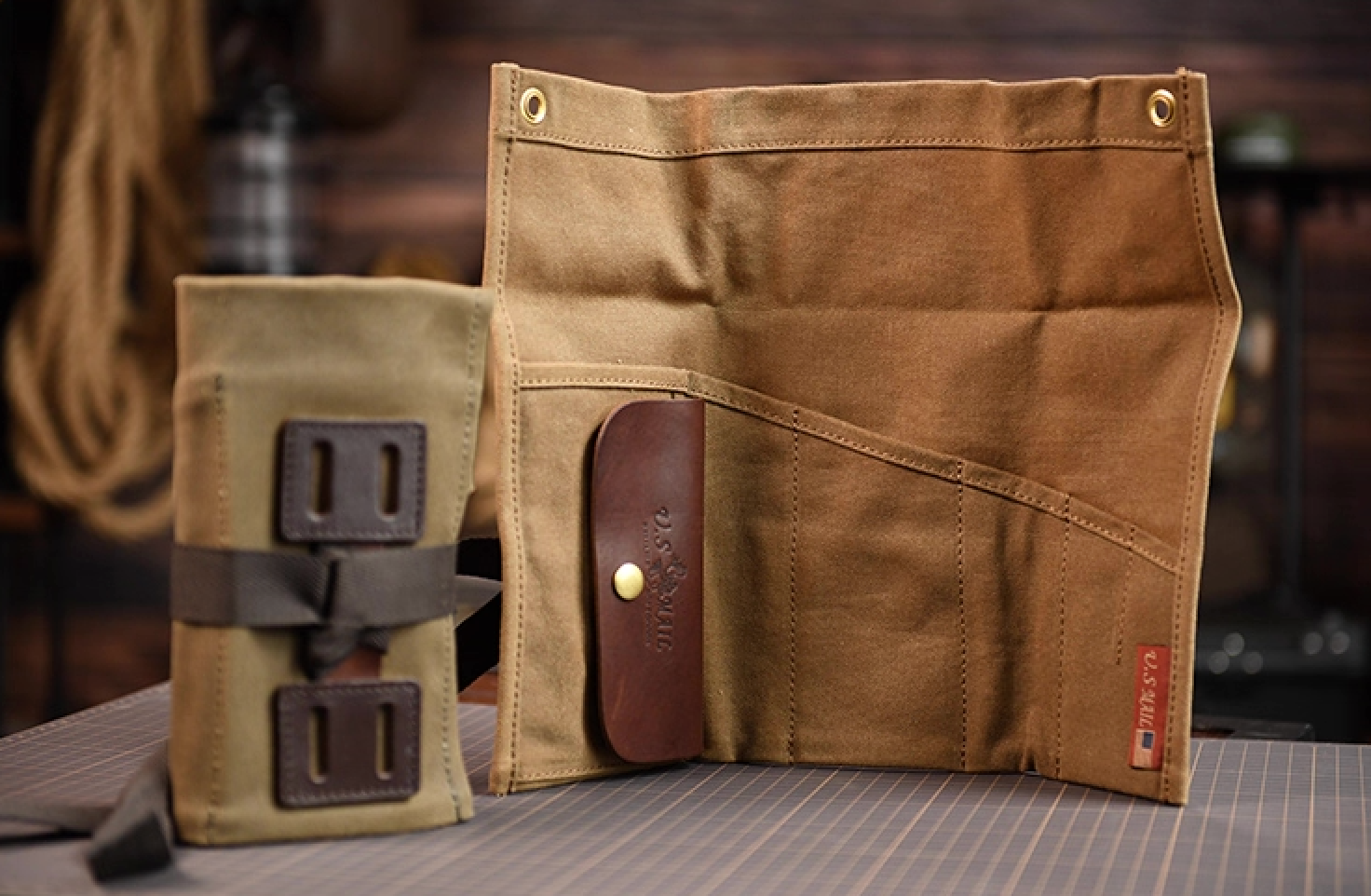 Close-up of Field Companion’s brass eyelet, stitched canvas and leather trim.