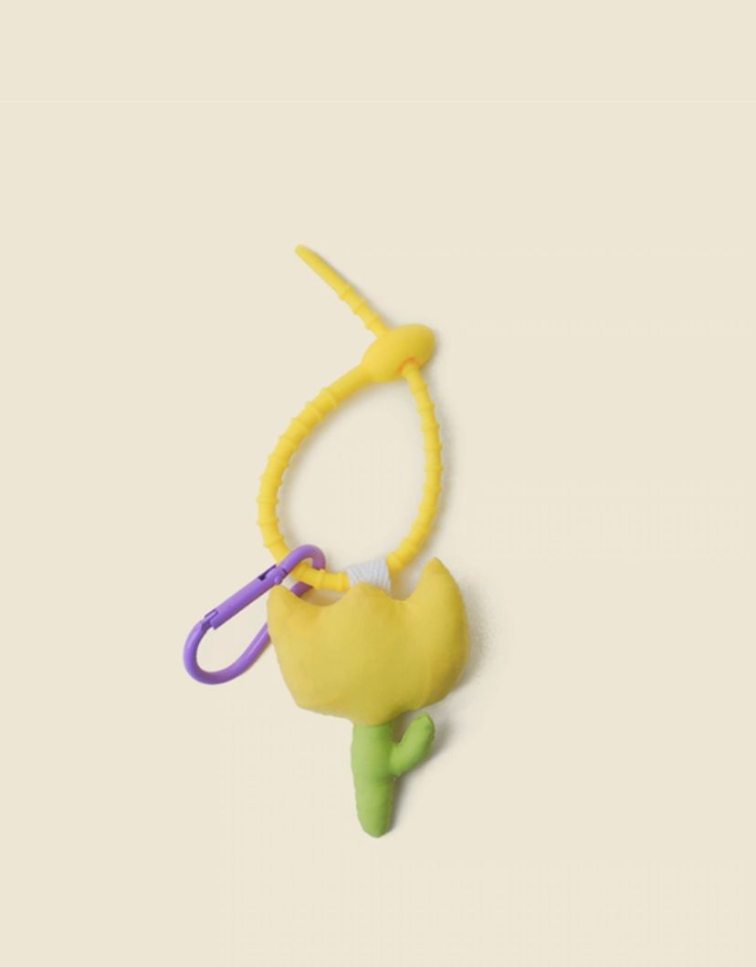 Yellow tulip keychain charm front view with soft fabric flower and green stem design