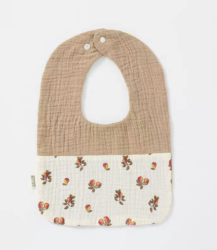 Khaki Pink U-neck cotton gauze baby bib with delicate pink floral pattern on the lower panel